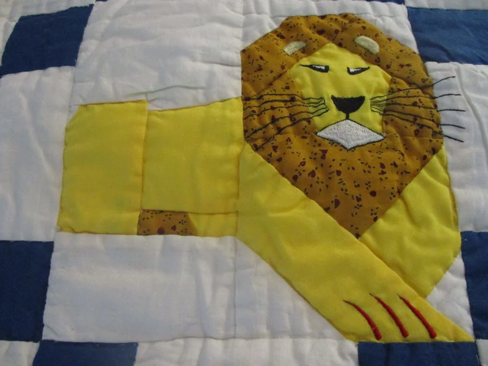 Isn't this lion magnificent? Look at those whiskers and the ears in the fabric mane.