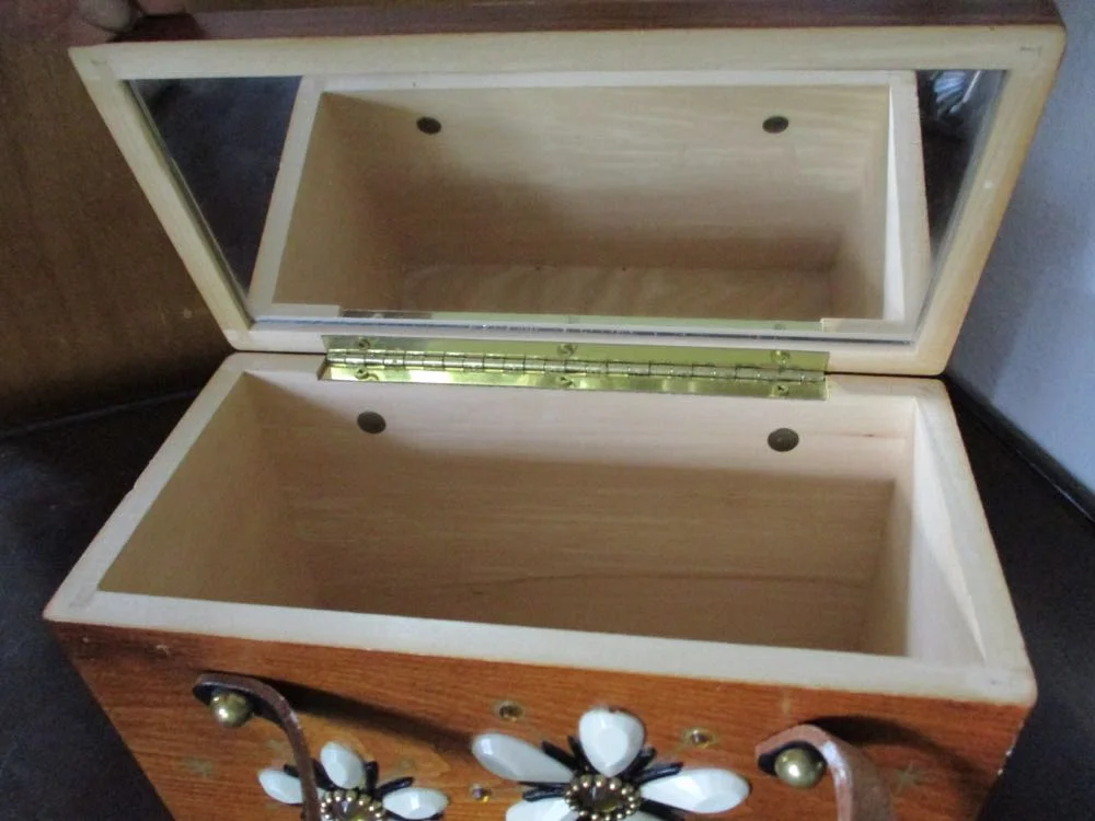 Inside of this wooden purse from the 1970s is in pristine condition.