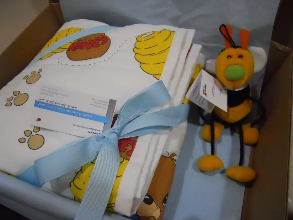 The little Gund honeybee is delivering the free gift tag with the handmade baby crib quilt.