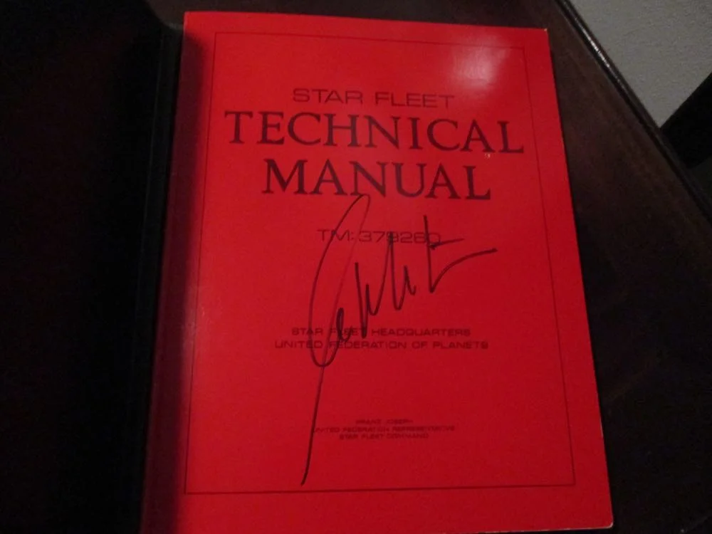 This is 1975 First Edition Star Fleet Manual autographed by William Shatner up for auction.