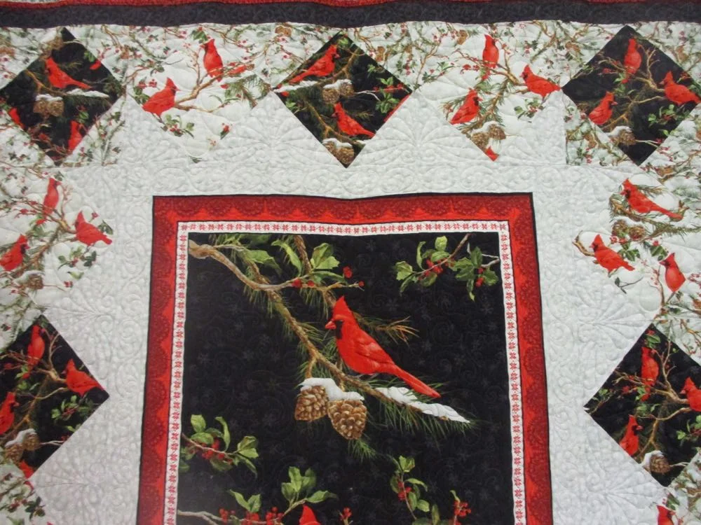 Closer look at the beauty of the printed cotton panels in this charming handmade quilt.