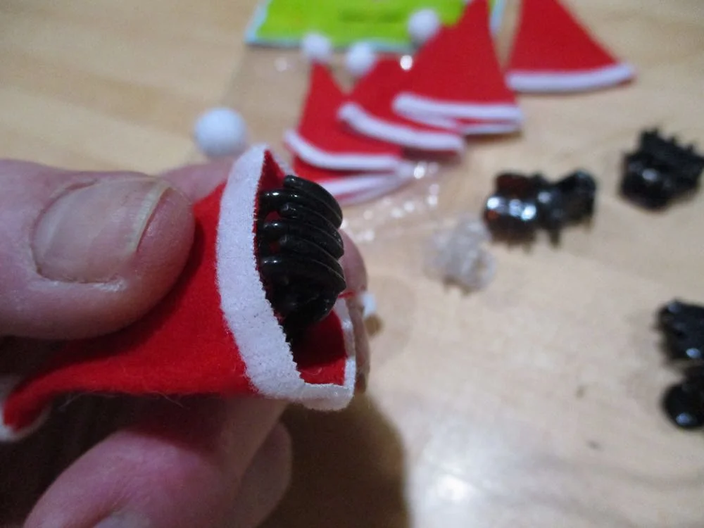 Place the hair clip inside the hat and either hot glue sides to the clip or sew the clip to the hat.