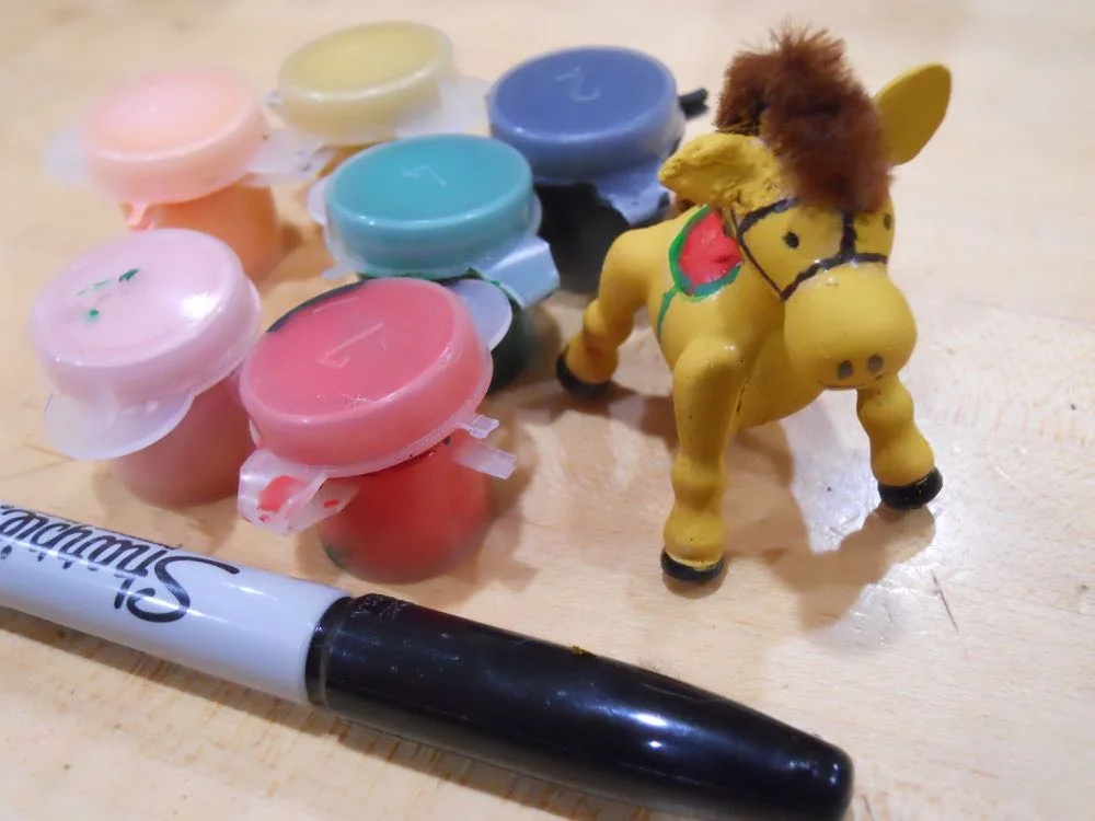 This little wooden horse now has a new right ear and paint job. 