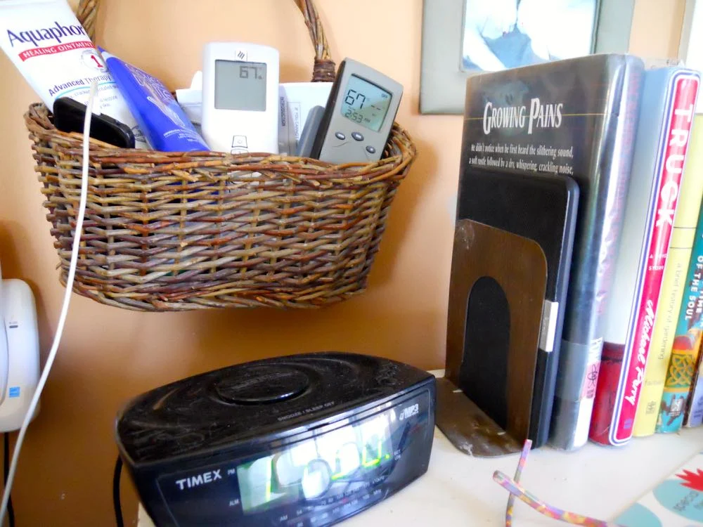 I have my Kindle here, only I keep it with the books instead of taking up space on the table top.