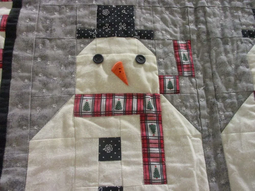 Love the way the scarf has a little movement in the patchwork quilt design.