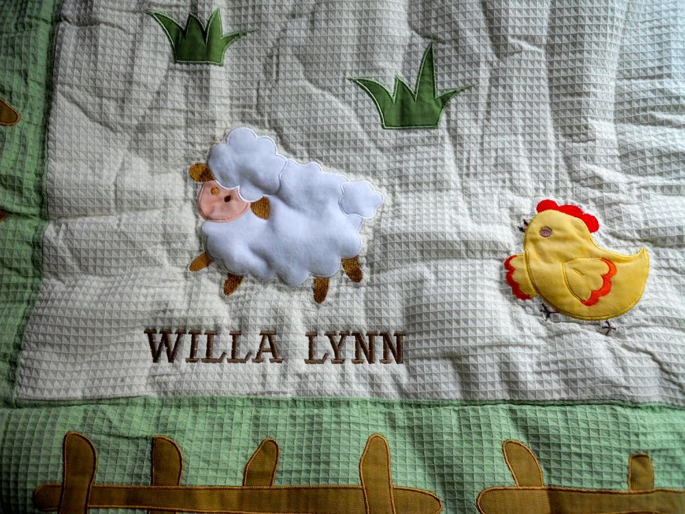 We personalized On the Farm Baby Quilt with custom embroidery on the bottom. (Photo by Charlotte Ekker Wiggins)