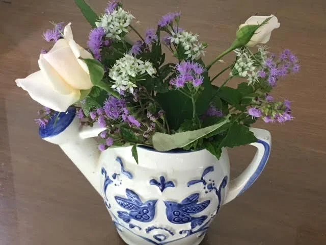Pick up small containers you can use as flower vases for gift flowers from your garden.