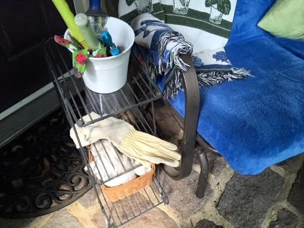 Here’s the plexiglass-covered wire plant stand as a side table with 3 different levels.