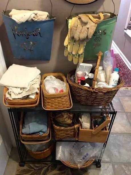 Similar baskets on the plexiglass-covered wire plant stand work well for handy storage.