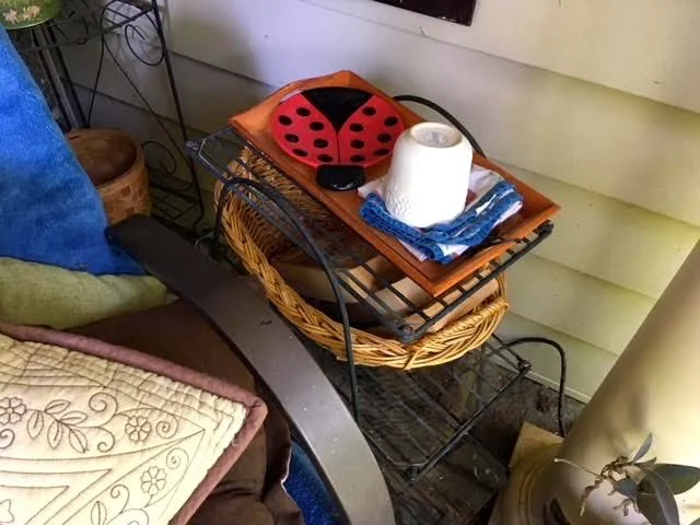 Add baskets to the wire plant stand shelves for easy handy storage.
