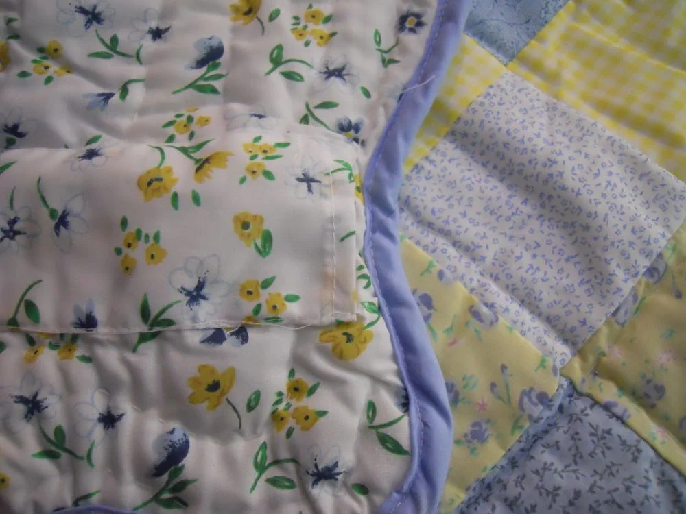 Close up of the backing and sleeve on Blue Yellow Ninepatch Lap Quilt and Wall Hanging.