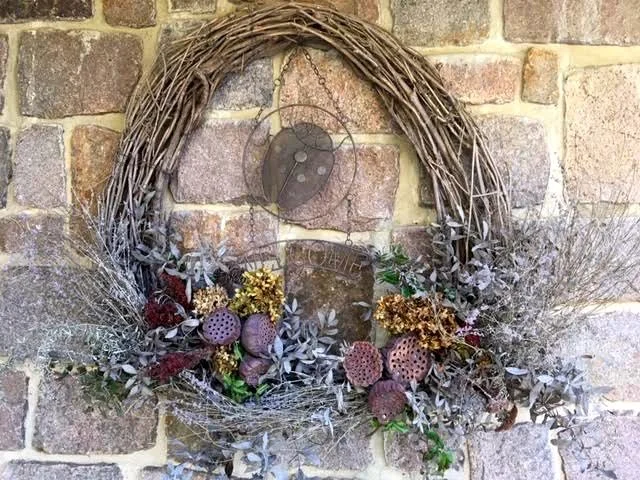 This large wild grape vine wreath hangs from a dowel in the mortar. (Photo by Charlotte Ekker Wiggins)