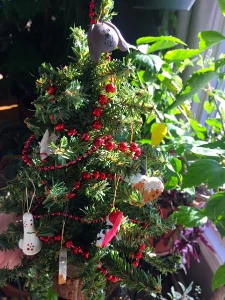 Tiny artificial Christmas tree with dog ornaments. (Photo by Charlotte Ekker Wiggins)
