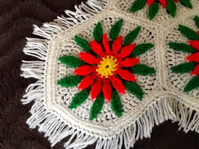 Each corner is finished off with a cream colored yarn and fringe. (Photo by Charlotte Ekker Wiggins)