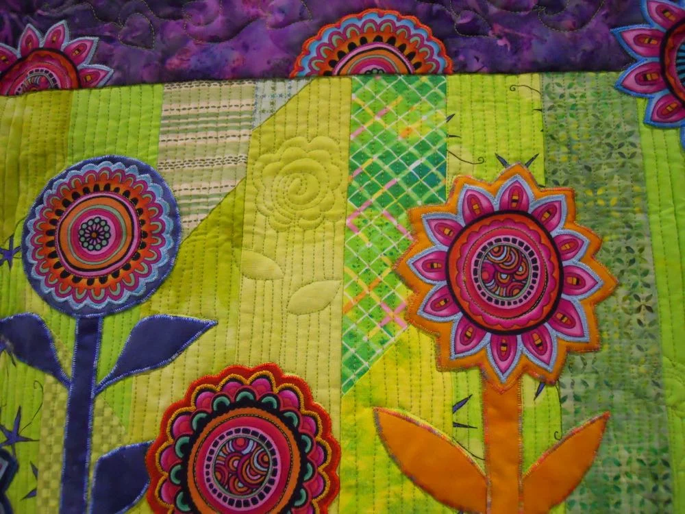 Quilting adds a lovely dimension to Lollipop Garden Handmade Quilt Wall Hanging. (Photo by Charlotte Ekker Wiggins)