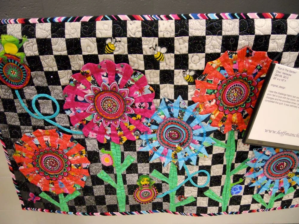 These lollipop flowers have flying friends with those bee buttons. (Photo by Charlotte Ekker Wiggins)