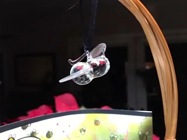 One of our handblown glass bee ornaments topping this gift basket. (Photo by Charlotte Ekker Wiggins)