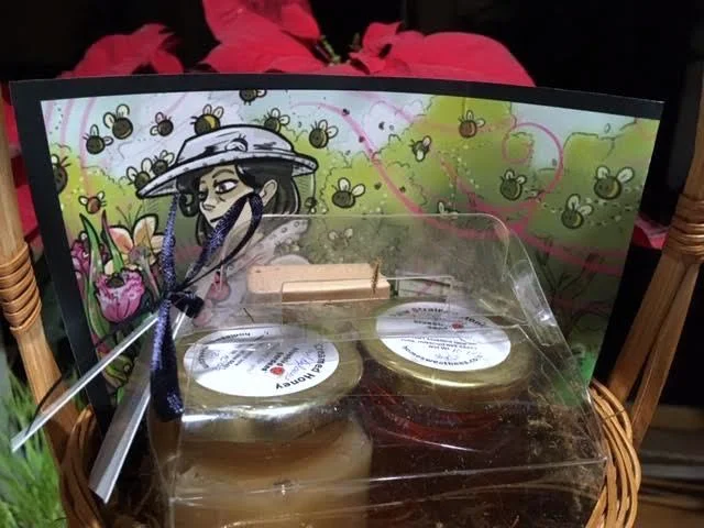 The gift basket includes two jars of our Bluebird Gardens honey. (Photo by Charlotte Ekker Wiggins)