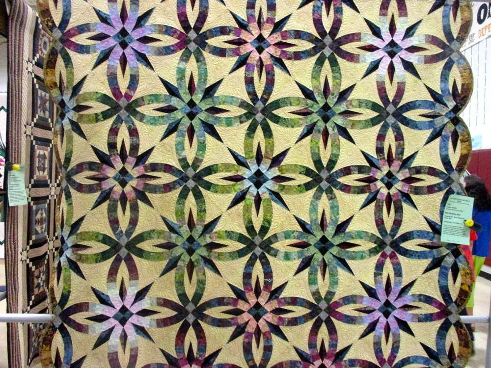 Stunning custom wedding ring quilt, can you see all of the patterns? (Photo by Charlotte Ekker Wiggins)