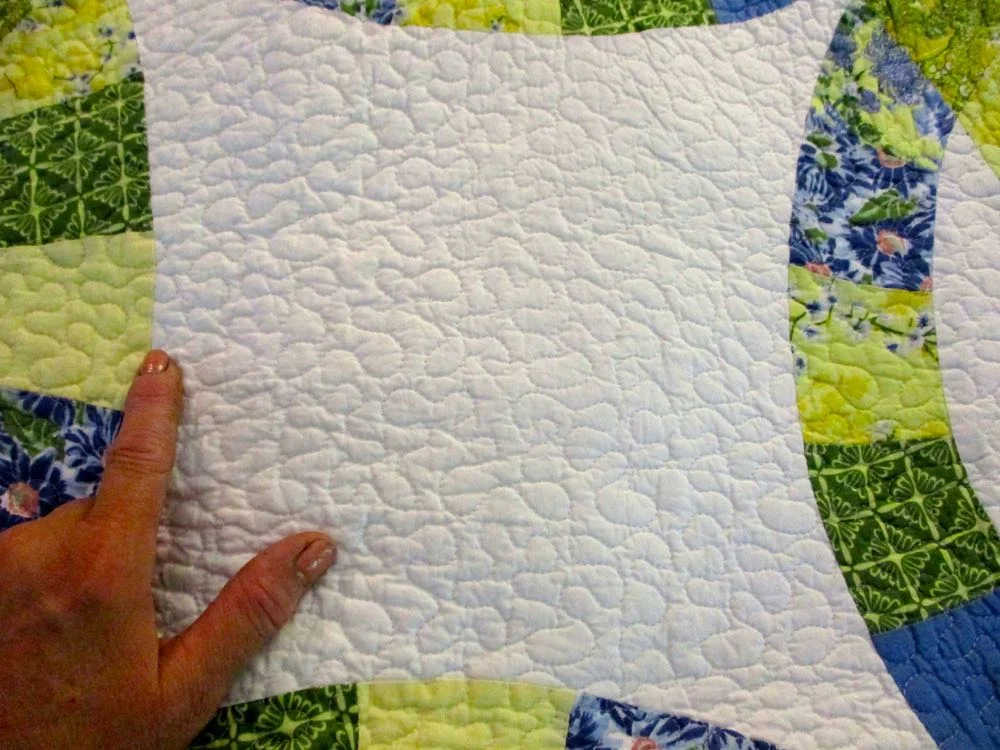 Detailed machine quilting gives this wedding quilt extra dimension. (Photo by Charlotte Ekker Wiggins)