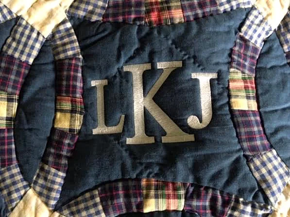 This little boy now has a new last name, made larger in this custom embroidery. (Photo by Charlotte Ekker Wiggins)