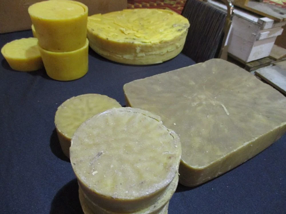 One the left, wax cappings from extracting honey, this is the primo wax.