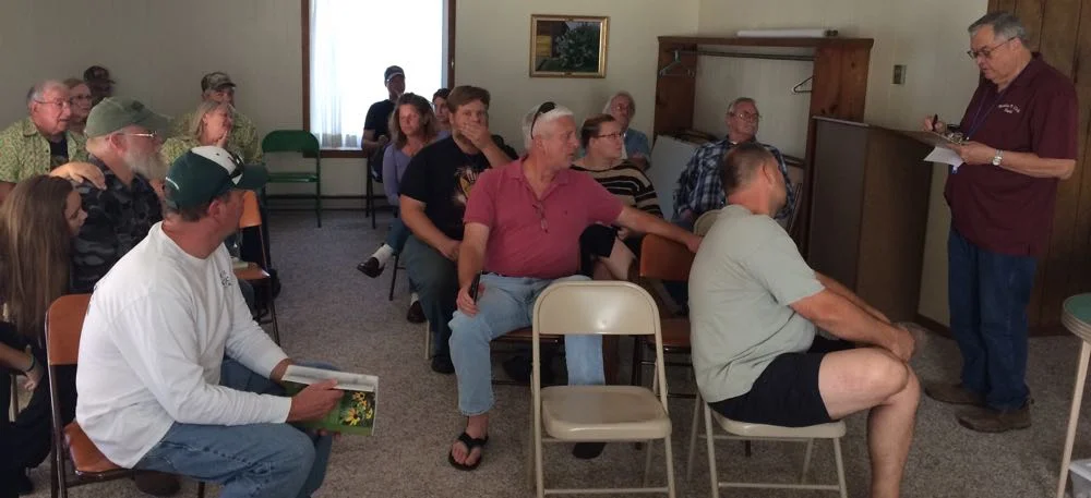 David Draker, right, guides a discussion at a monthly Rolla Bee Club meeting.