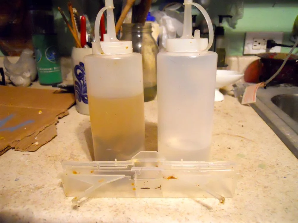 These plastic condiment bottles make quick work of refilling small hive beetle traps.