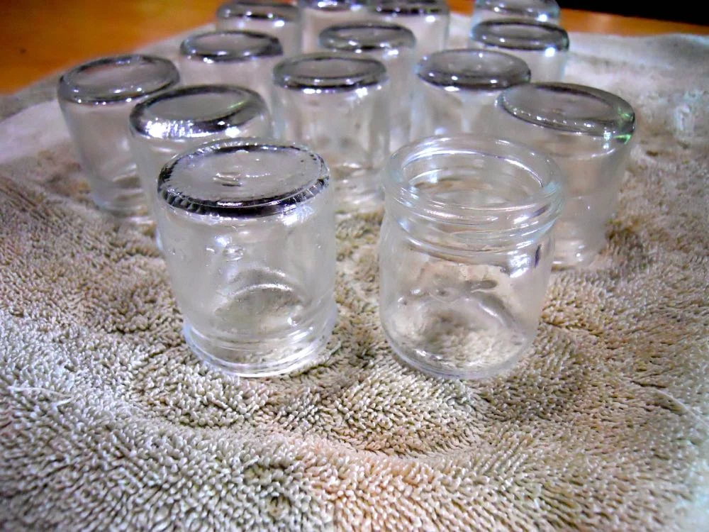 Once scrubbed and washed, my jars are sitting upside down to dry, except for the one in front.