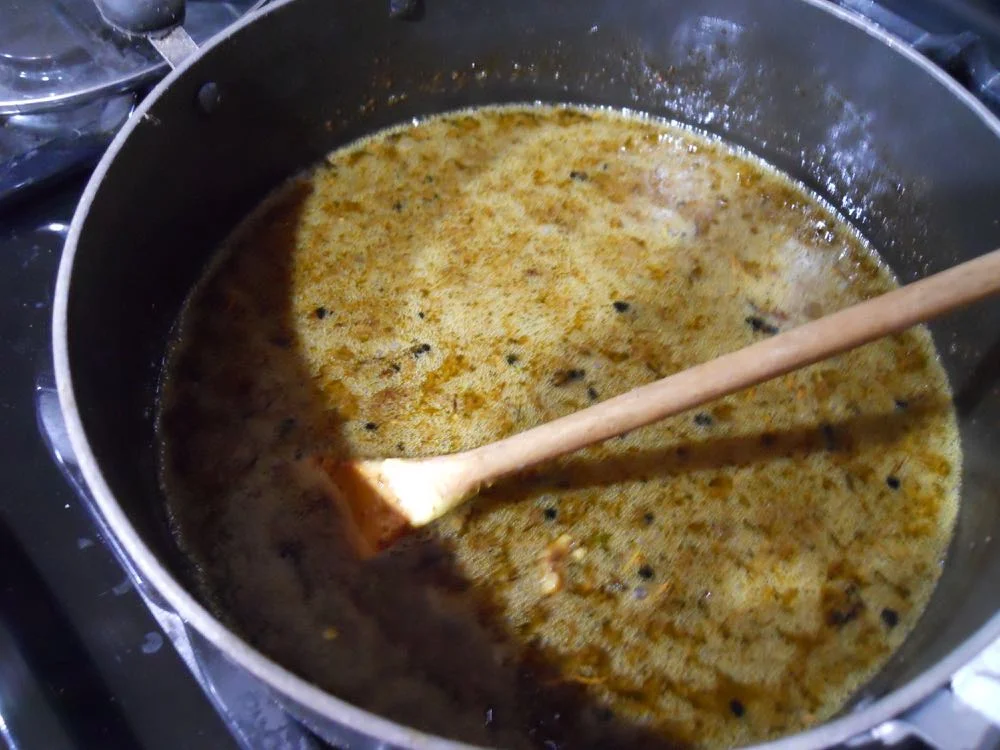 This is wax and other debris in water heated over medium heat. Wax is slowly melting.