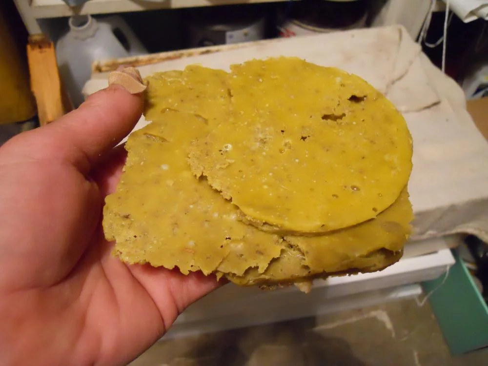 Wax will form in the shape of the container and float on top of the water.