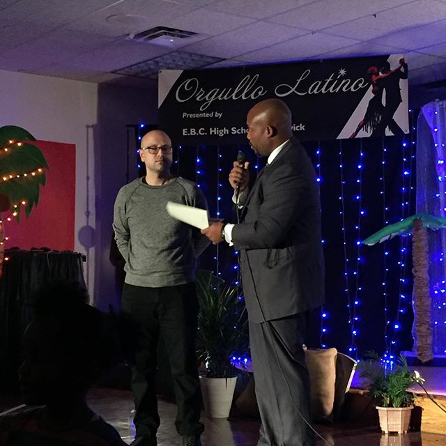 Principal Shawn Brown presenting a thank you to @arjanzazueta at the Orgullo Latino Celebration at EBC this evening. Arjan took the time out of his schedule teaching art at Illinois State University to donate his time to our students. Painting, spend