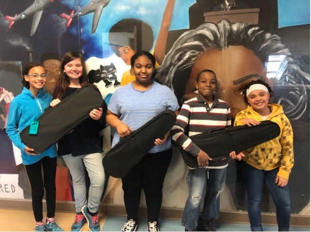 Here&rsquo;s a picture from our newest recipients, #rocmusic with their new violins and violas! Thank you to @krutz_strings and @elsistemausa for partnering with us on this project! #lovemusic #socialchange #socialchangemakers #playmusic #guitars4gif