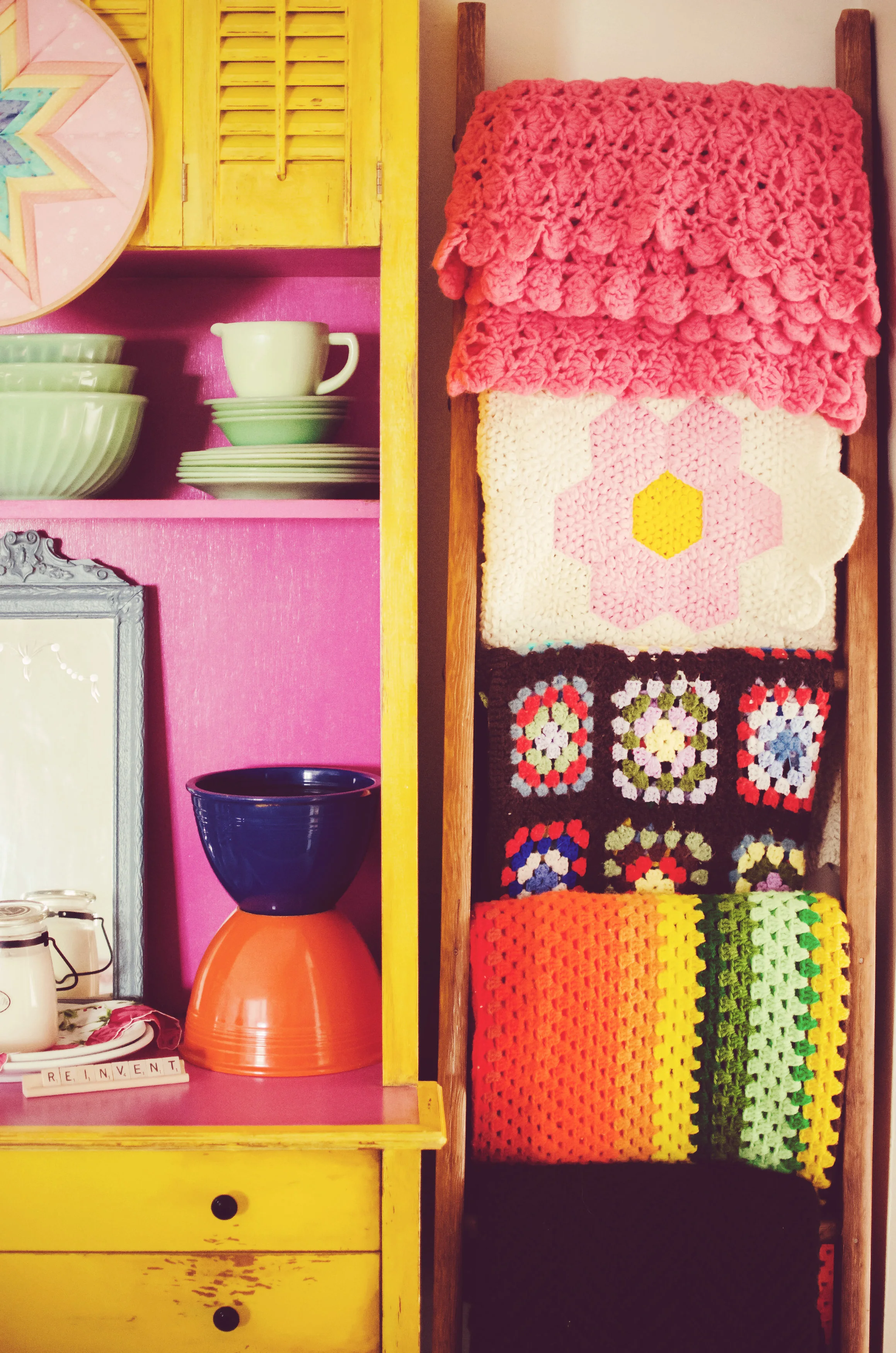 Bright vintage blankets hanging on a ladder. | hprallandco.com