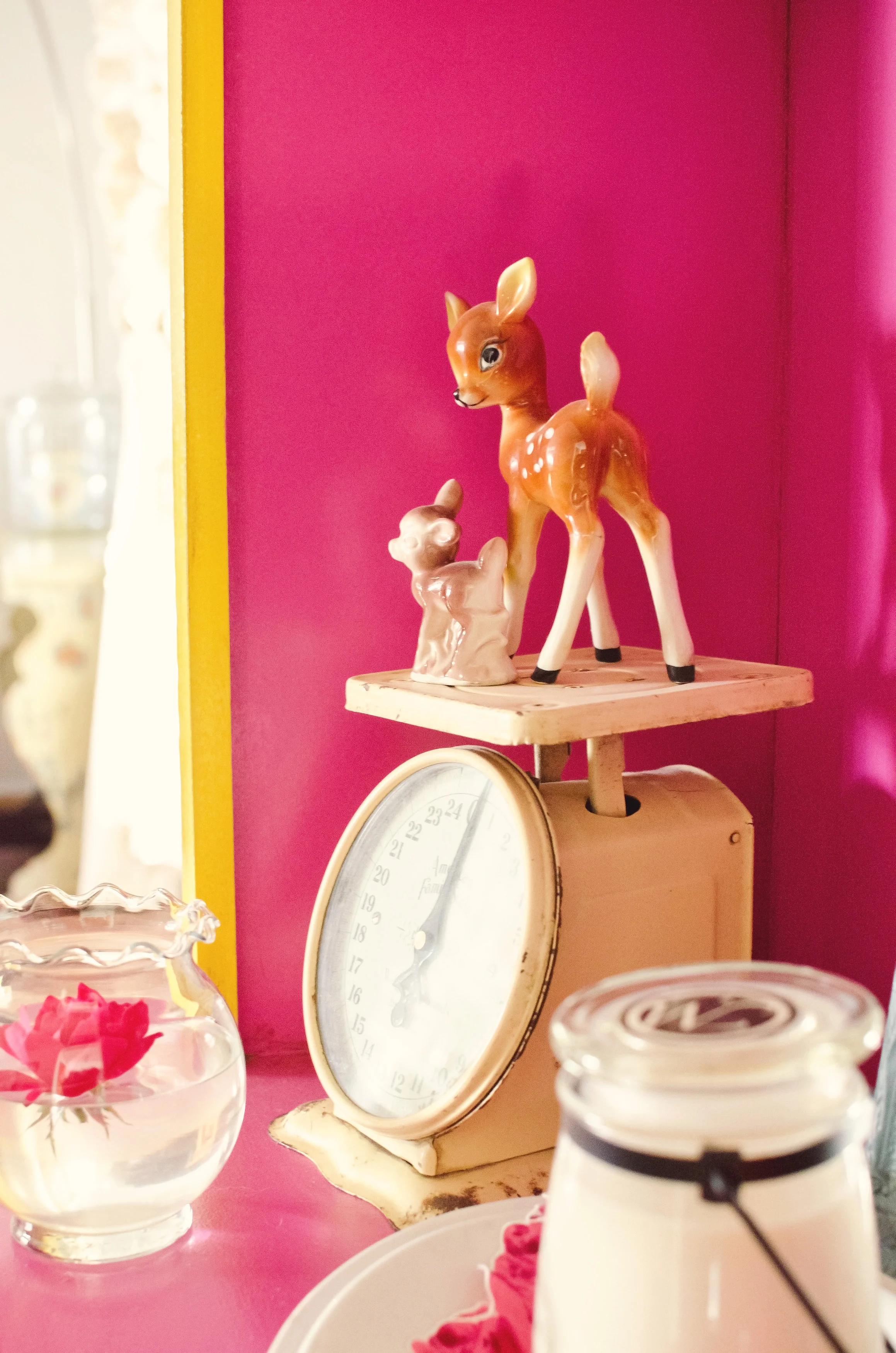 Hutch interior painted pink with a vintage scale and other vintage pieces as decor. | hprallandco.com