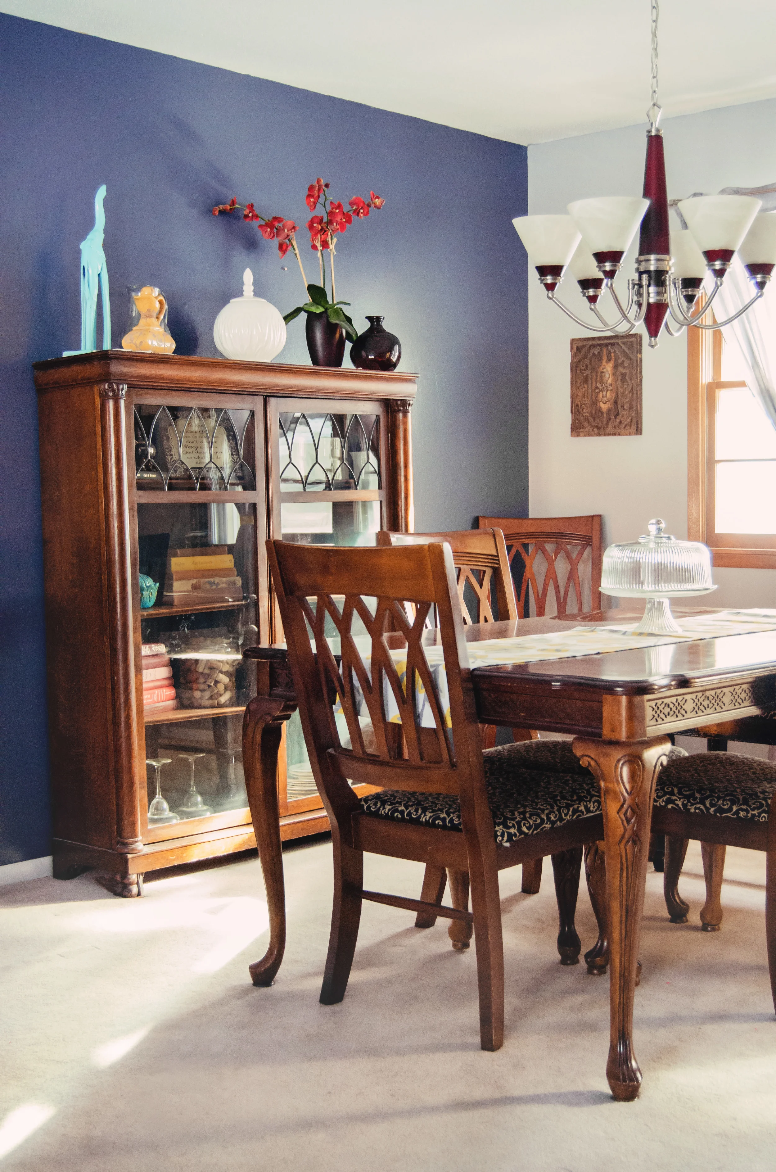 Dining room with a blue accent wall. | hprallandco.com