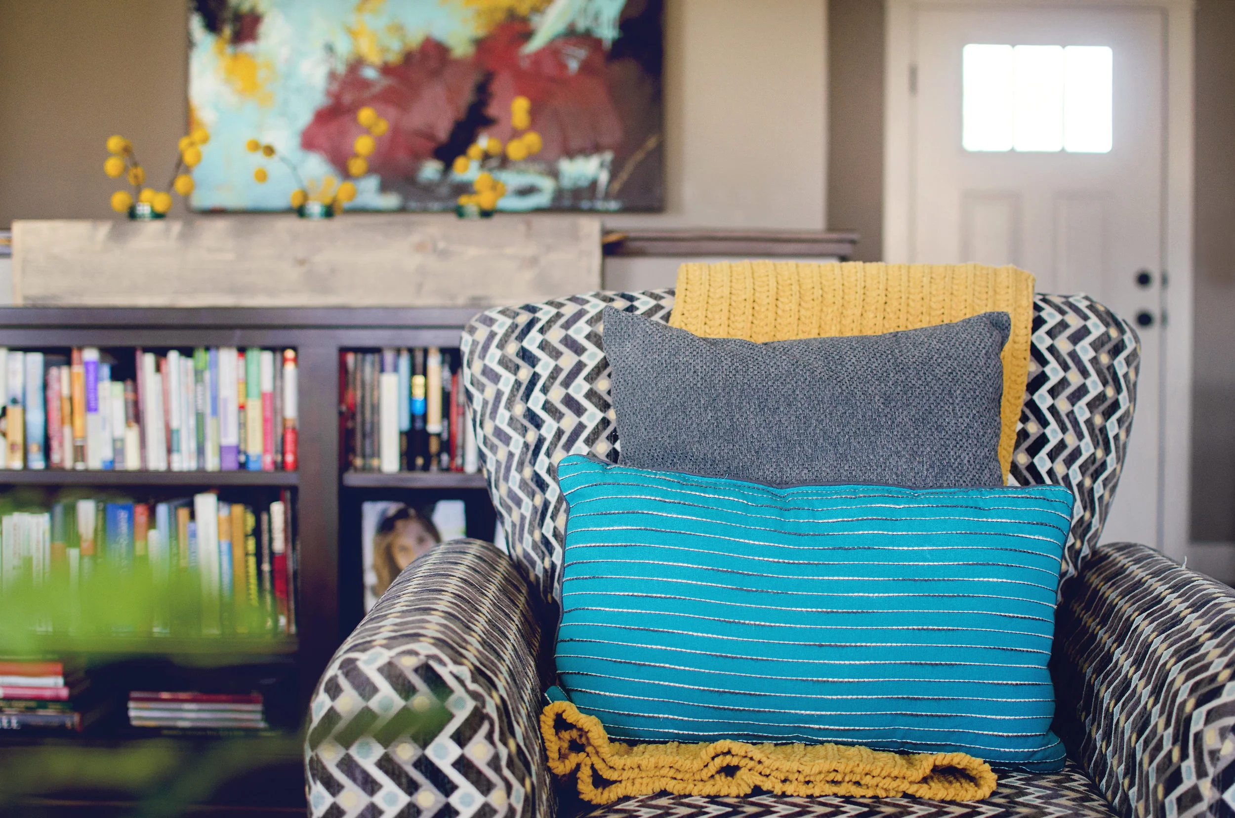 Patterned chair with bold color throw pillows. | hprallandco.com