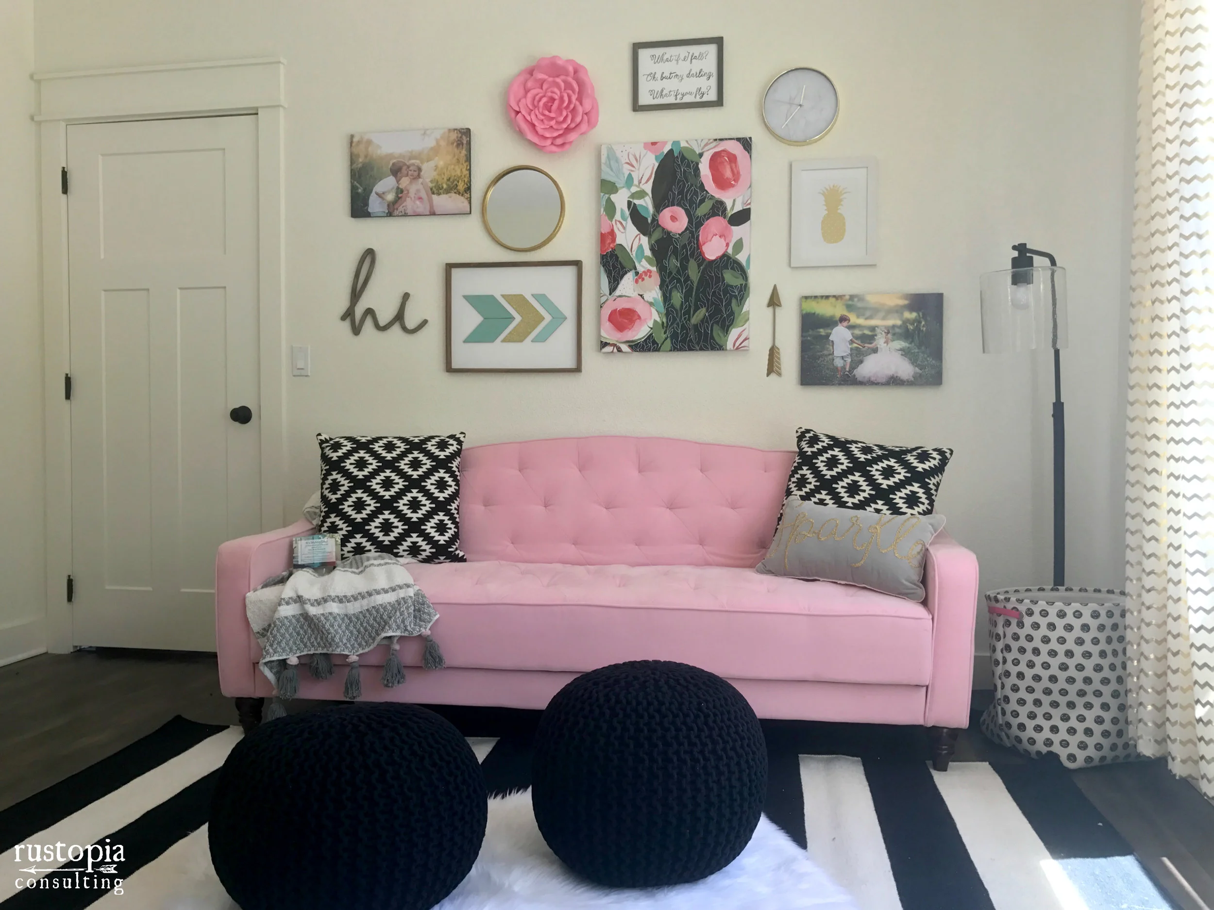 Home office gallery wall featuring pink art, and a pink couch | hprallandco.com