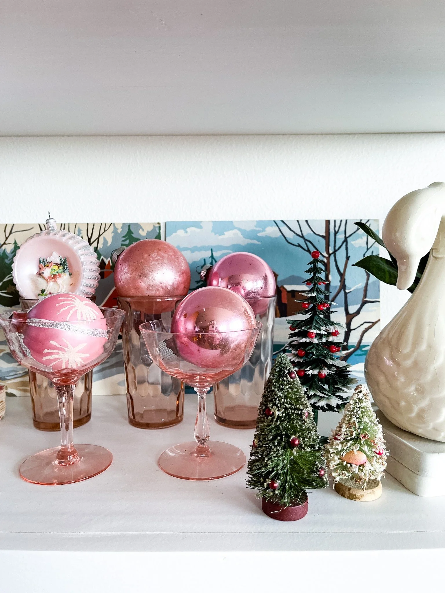 Vintage mercury glass and Shiny Brite ornaments in colored glassware. Vintage paint by numbers.