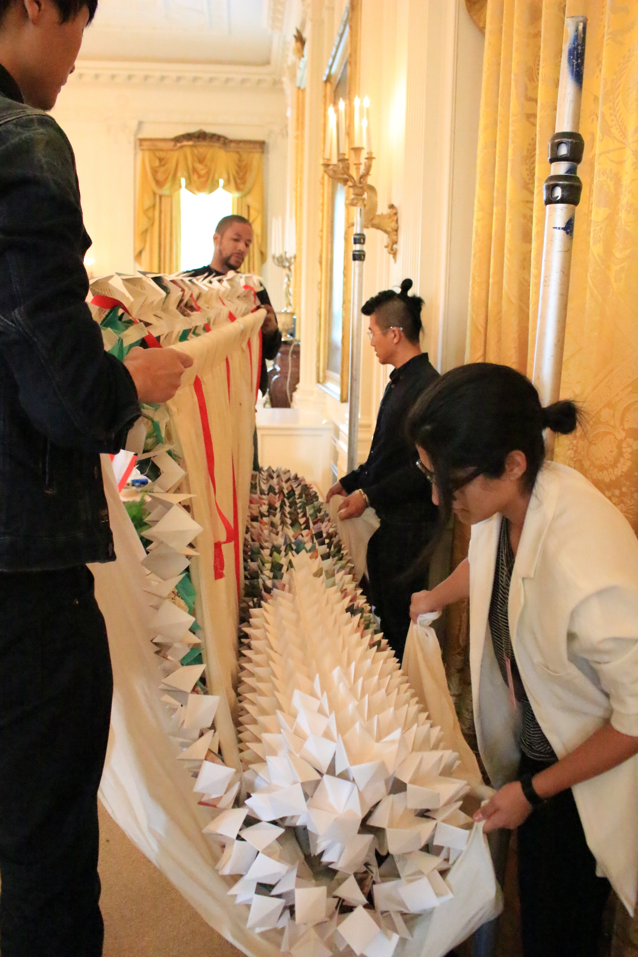 Muslin sheets were used to hold the weight of the folded paper sheet. They w also used to roll up the panels for transporting from New York to Washington, D.C. 