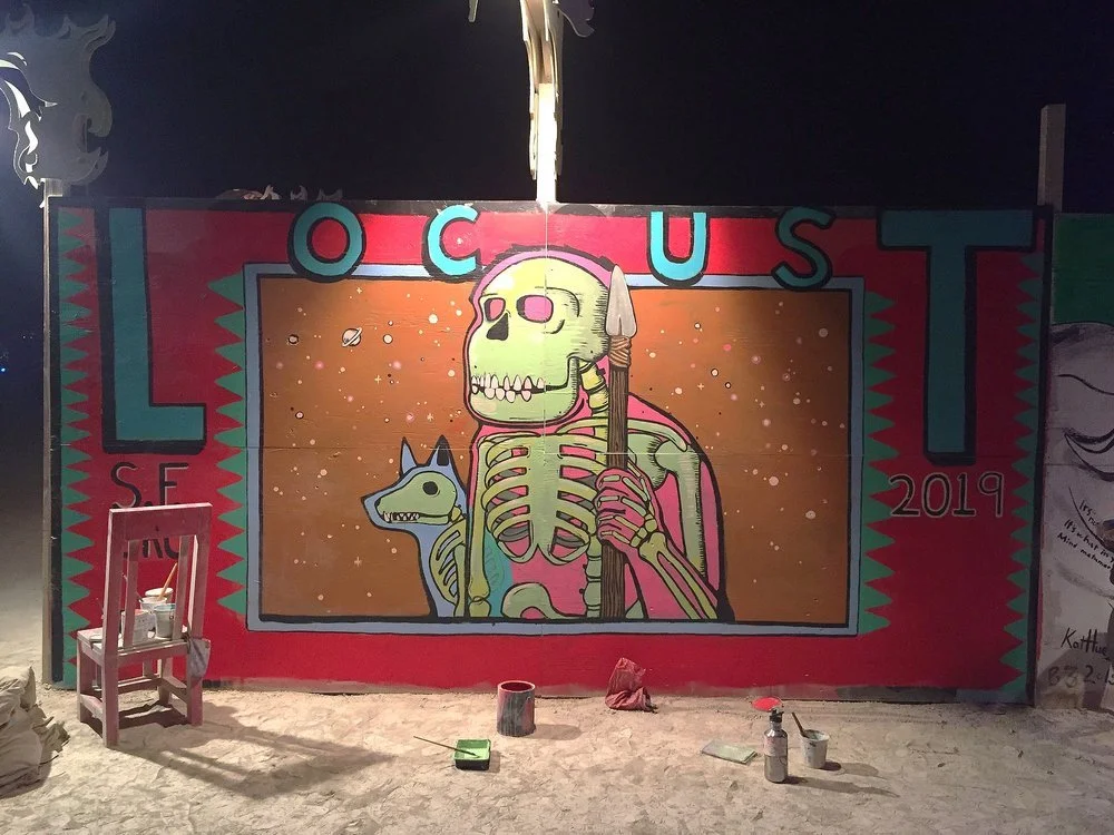 centercamp mural locust art burning man art locust artist center camp fence mural
