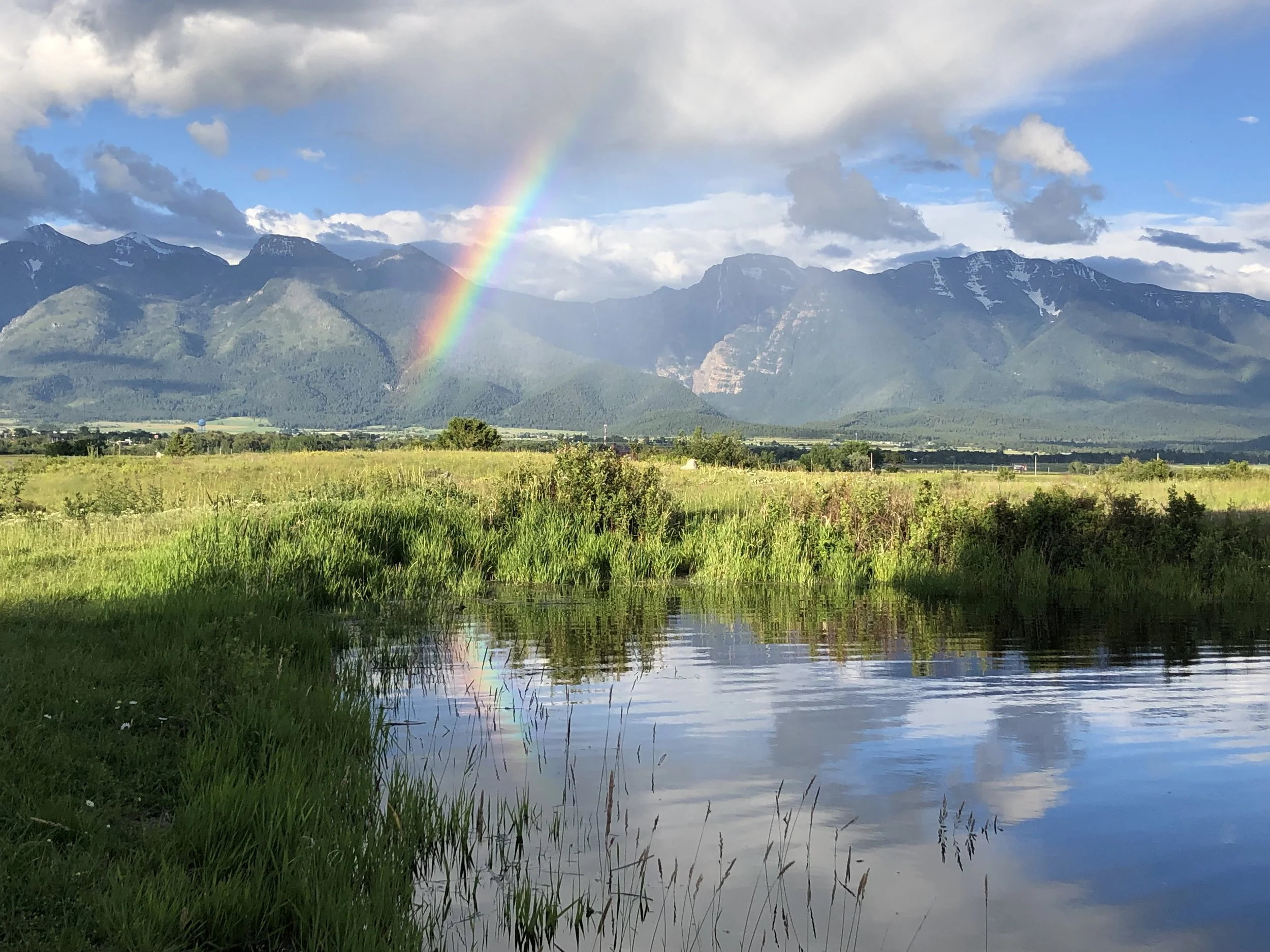 Rainbow on Mission Mountains and Seasonal Pond at Rugged Horizon