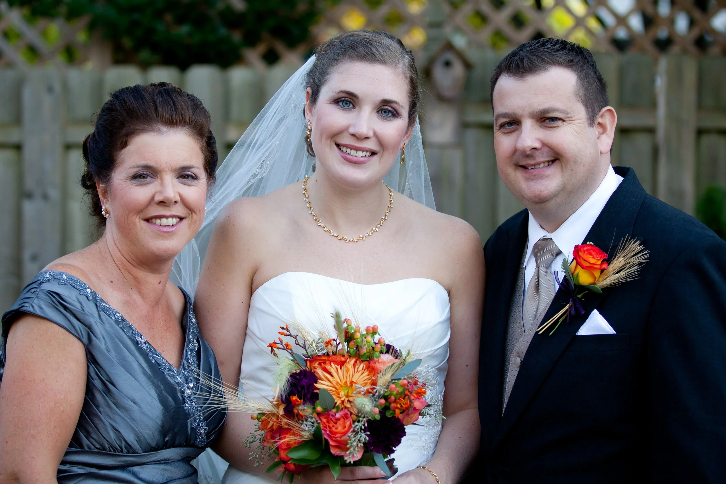 Marianne with her mom Linda and her husband Paul on their wedding day in 2011.
