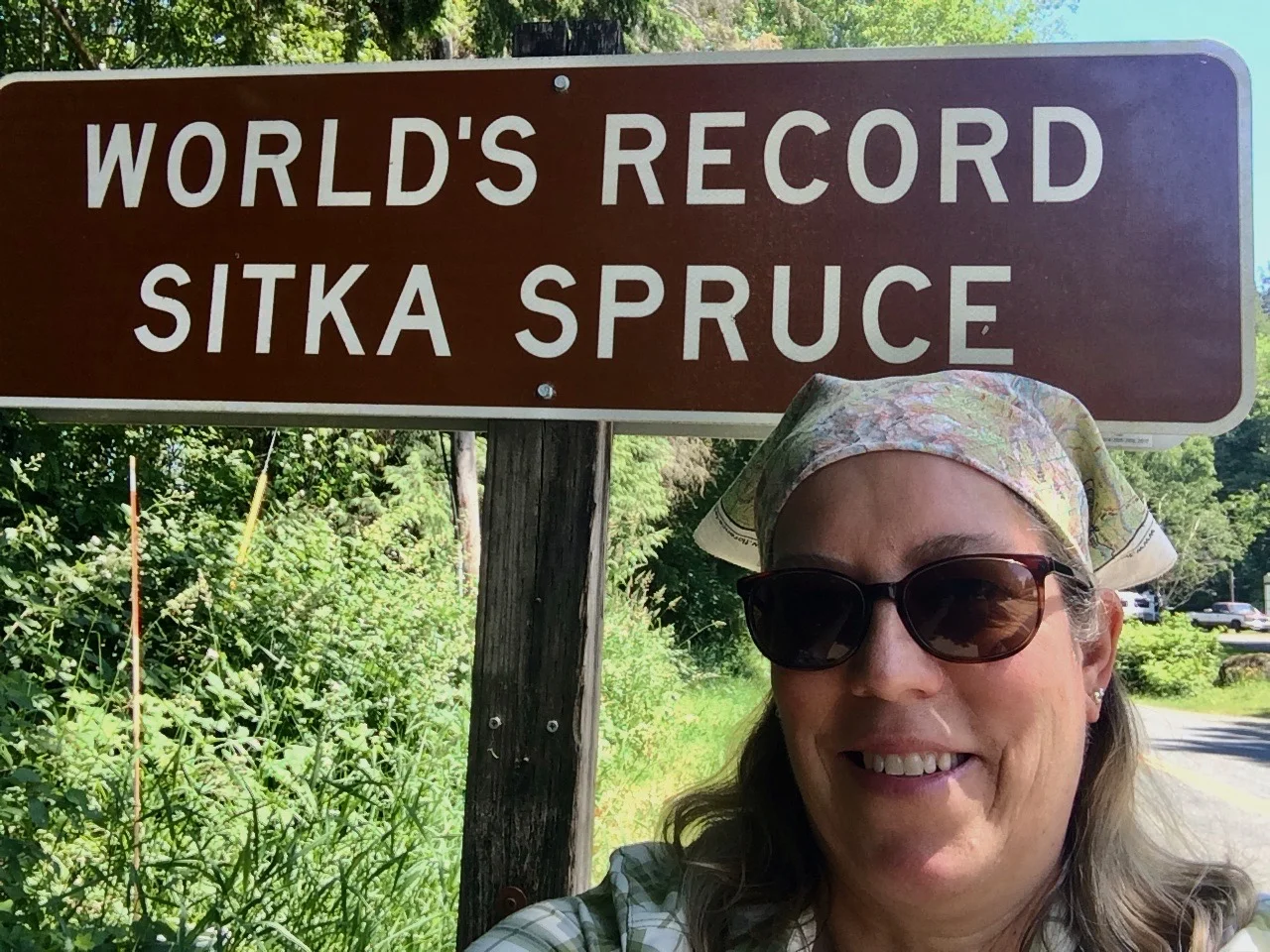 Selfie by the sign, not on the roots of the World's Largest Sitka Spruce. 