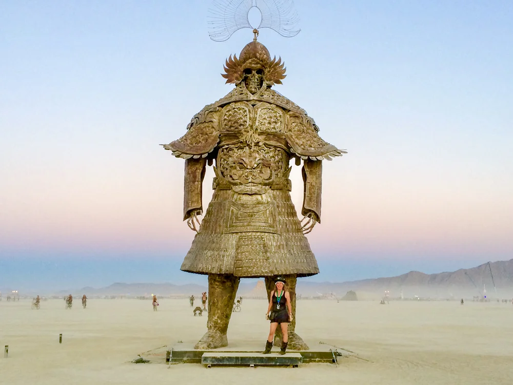 Making new friends at Burning Man. “Desert Guard” by Lu Ming from Beijing, China