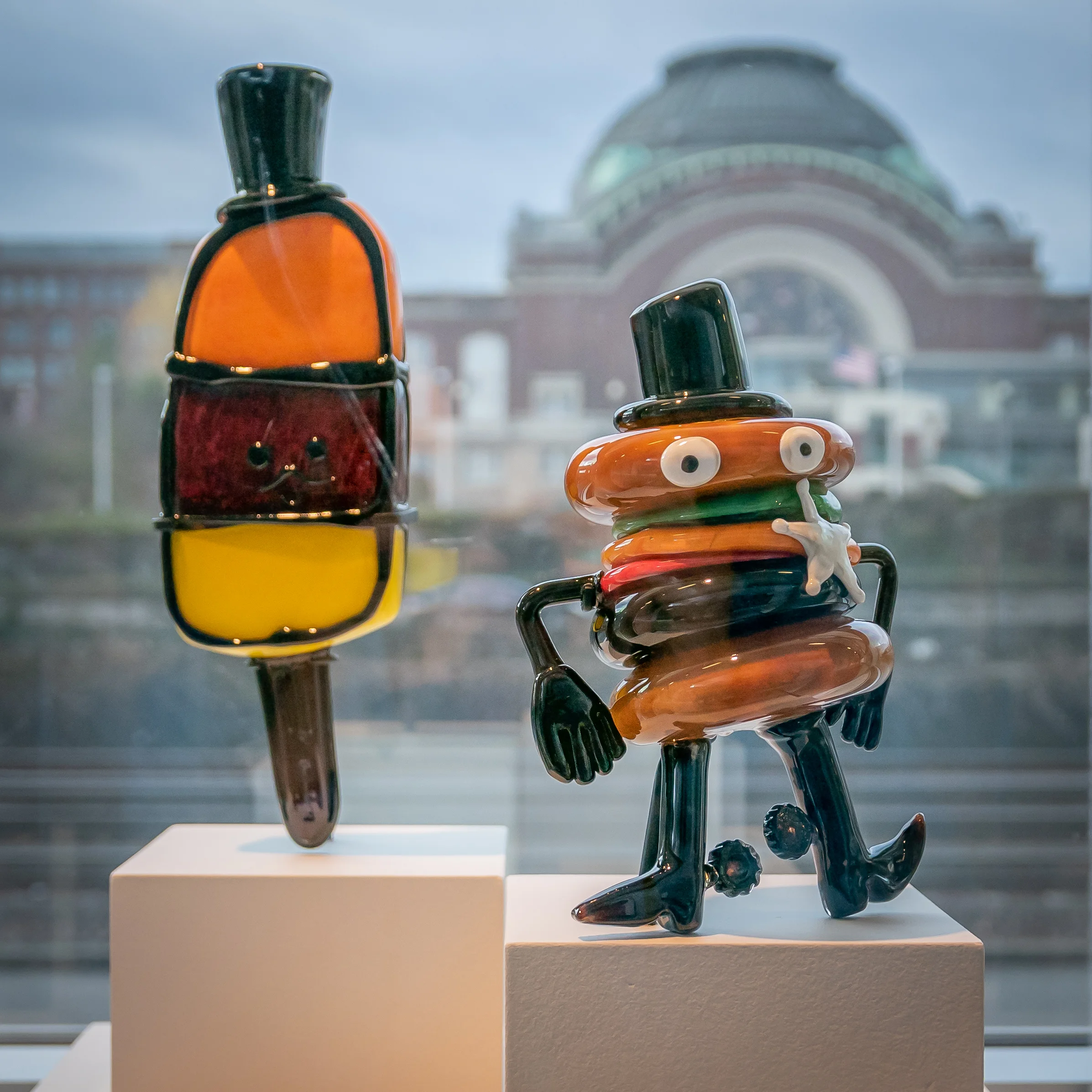 Mr. Popsicle “is British and likes to take ice baths.” Hamburger cowboy is something the artist read about.