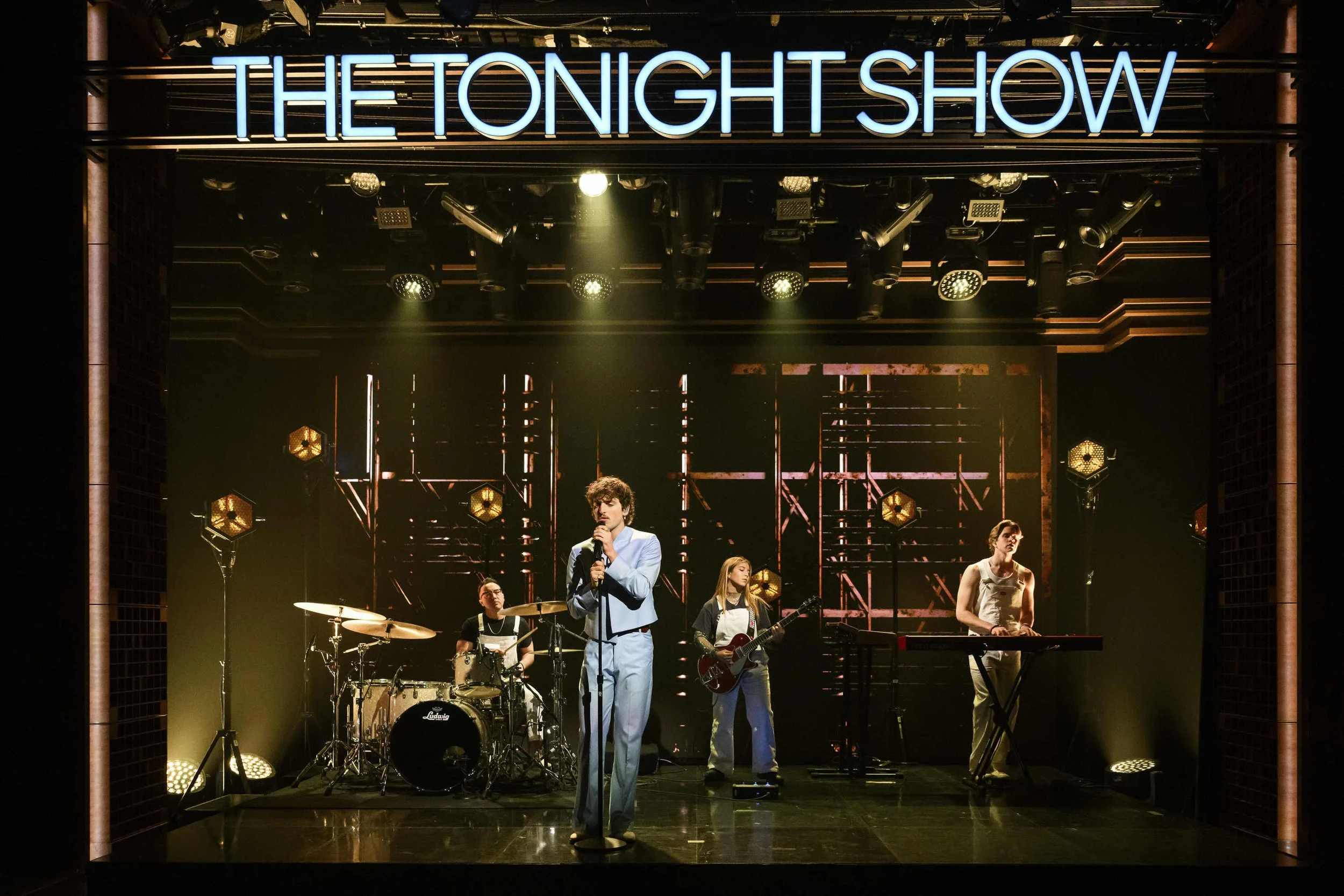 Benson Boone performing on THE TONIGHT SHOW starring Jimmy Fallon. Blue neon lights. Stage Design, Lighting Design, Concert - Mitchell Schellenger Designer