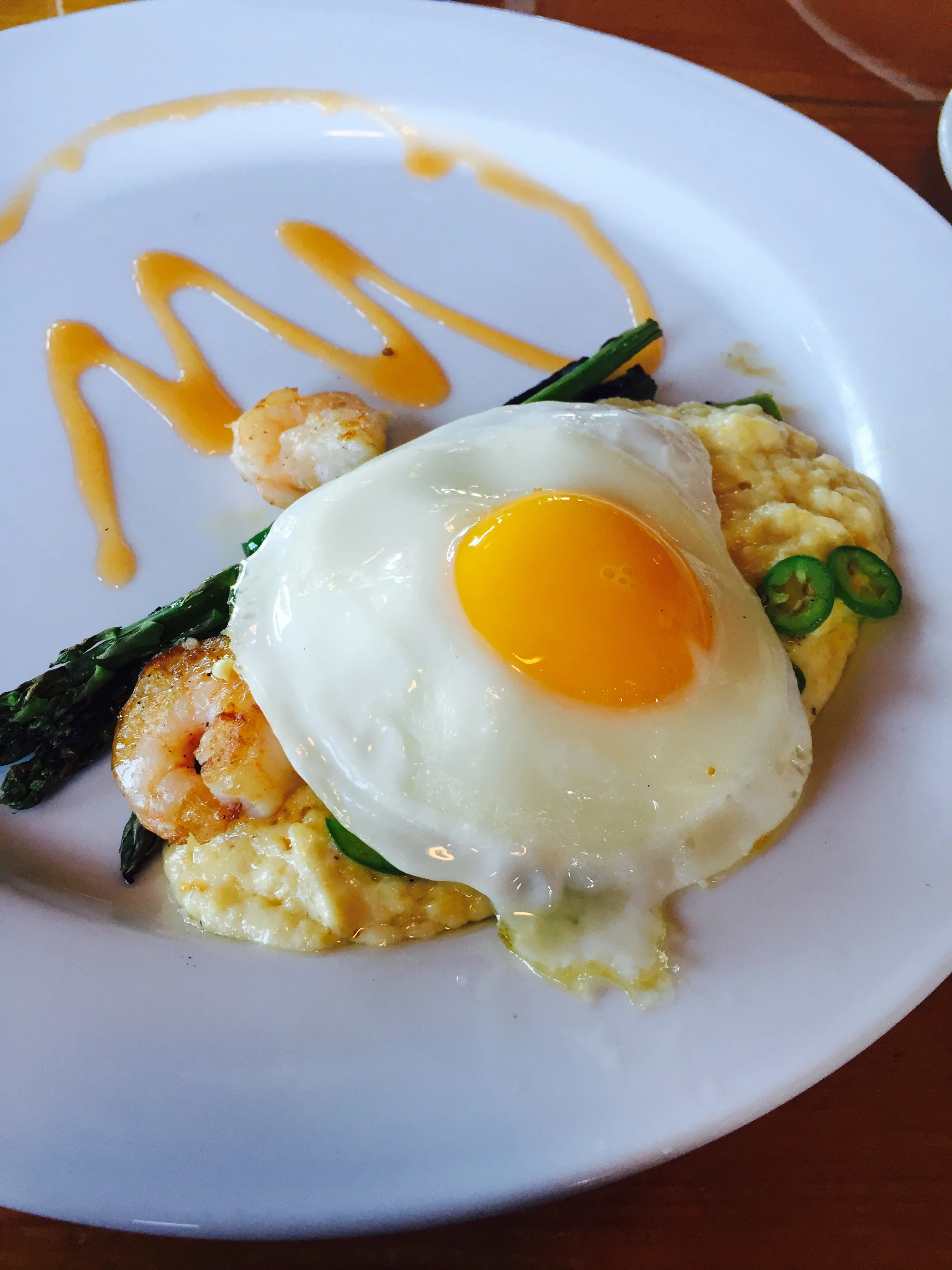 Shrimp n' Grits: chickpeas, asparagus, tomato, serrano, fried egg.