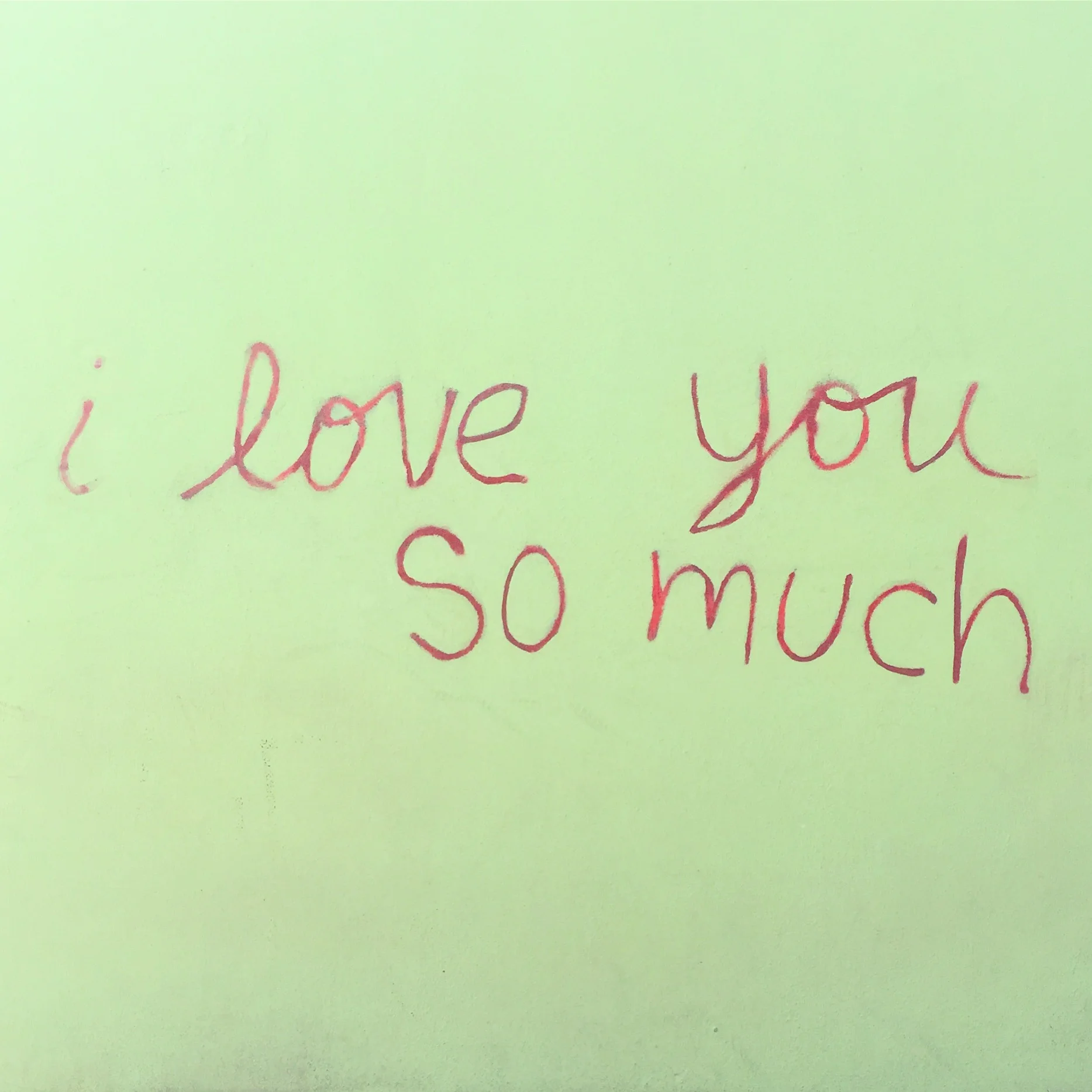 The famous 'I love you so much' mural is on the side of Jo's Coffee.