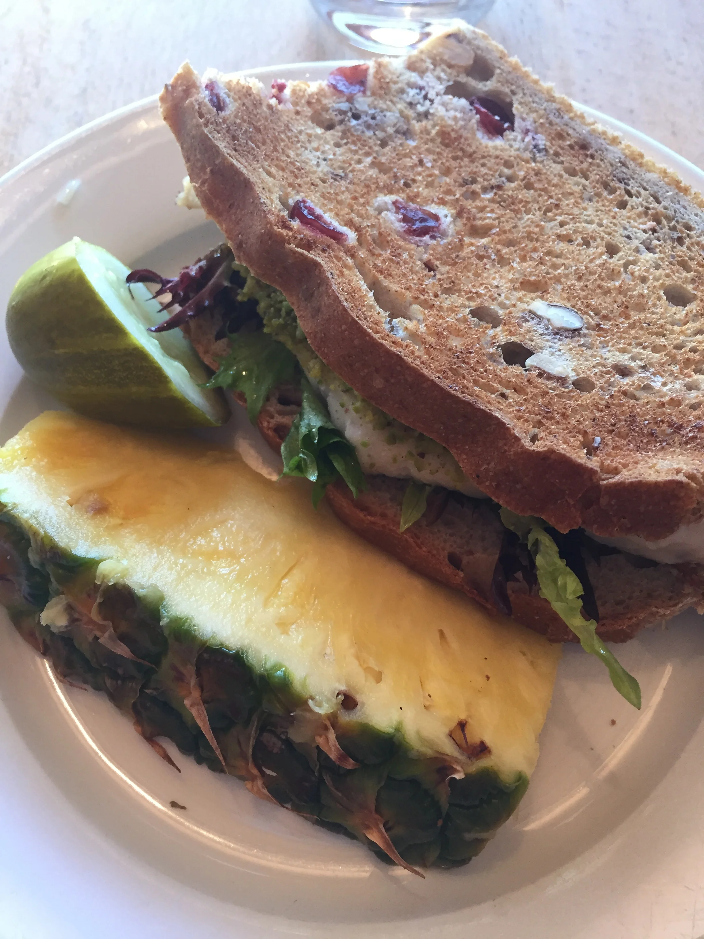 Pistachio crusted walleye sandwich on cranberry walnut bread